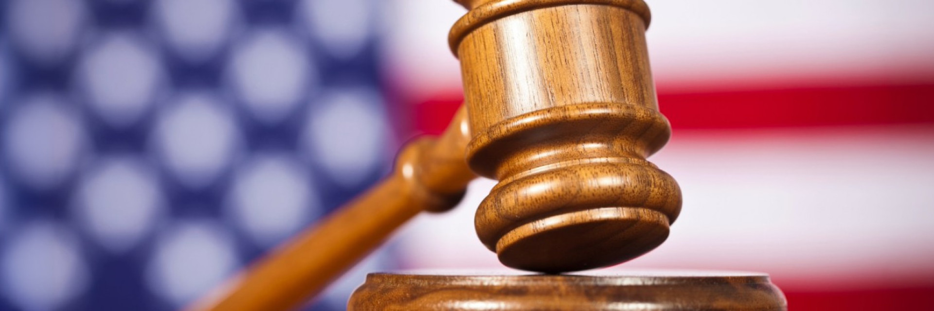 gavel with a flag in the background