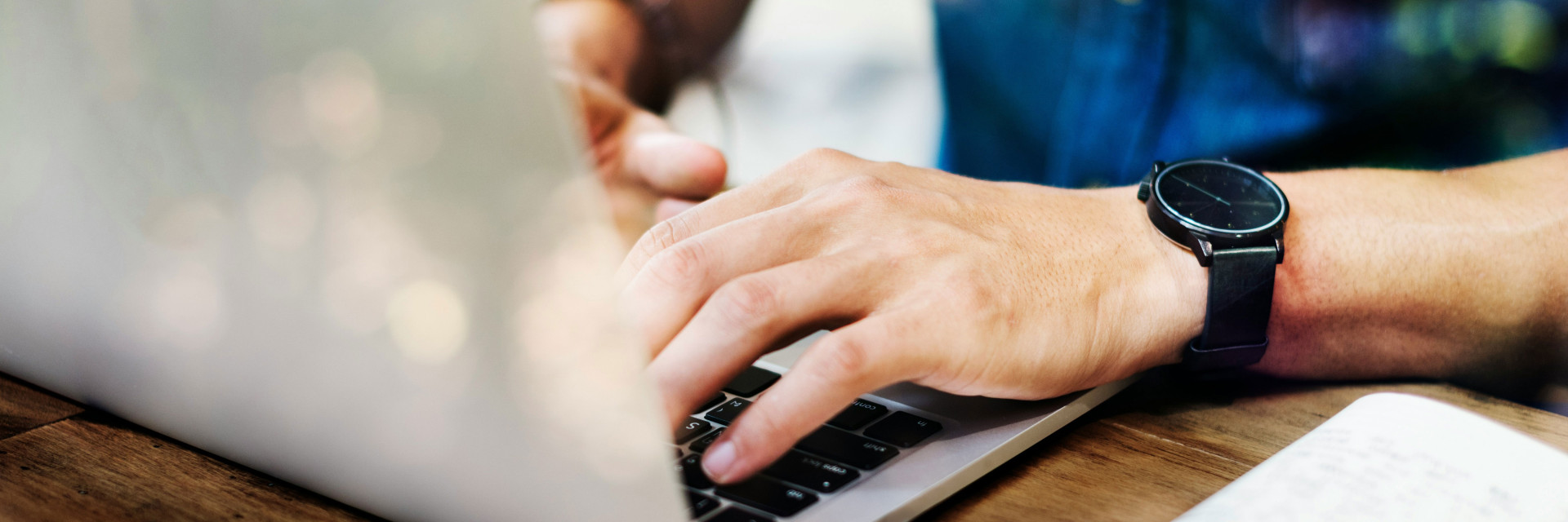 someone typing on a laptop
