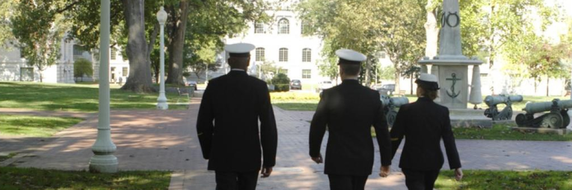 Military members walking down sidewalk