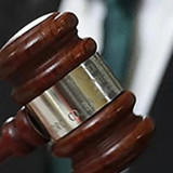 image of someone holding a gavel