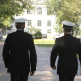 Military members walking down sidewalk